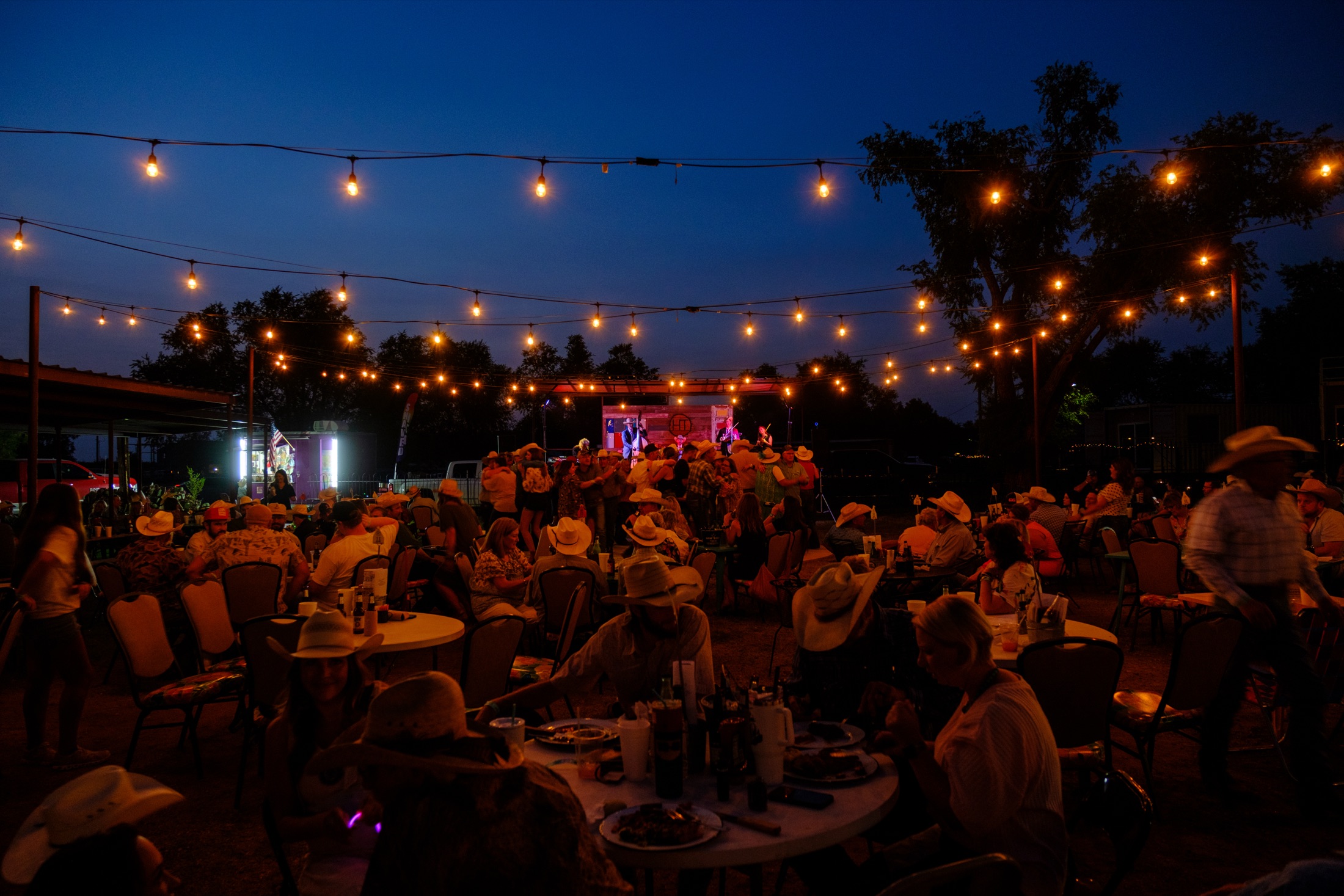 A crowd enjoying live music on the patio at Hotel Turkey